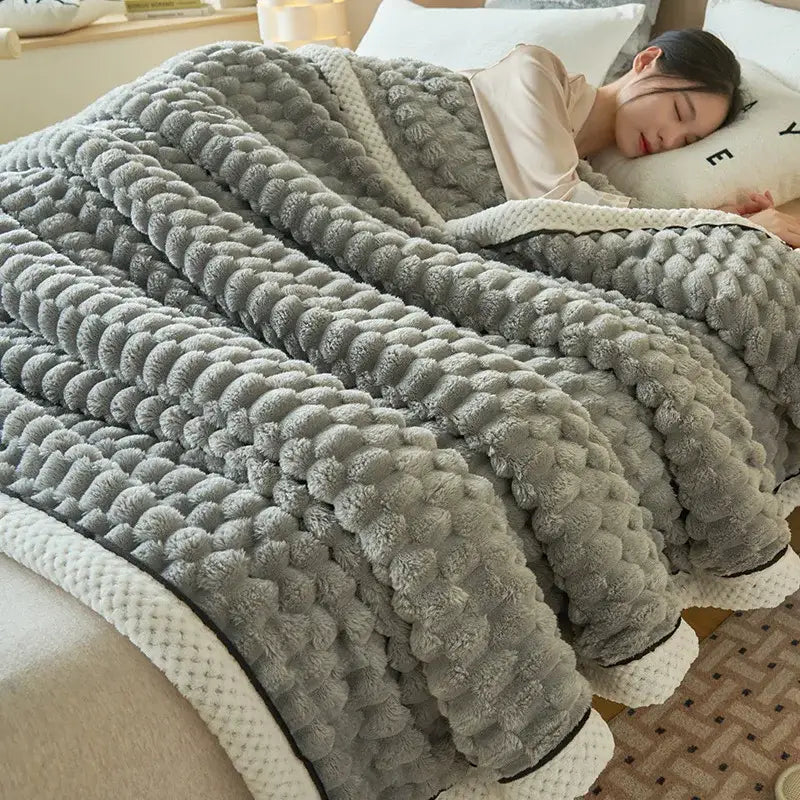 Soft gray plush coral fleece bed blanket with raised pom-pom pattern and white trim for decorbites cozy coral bedding
