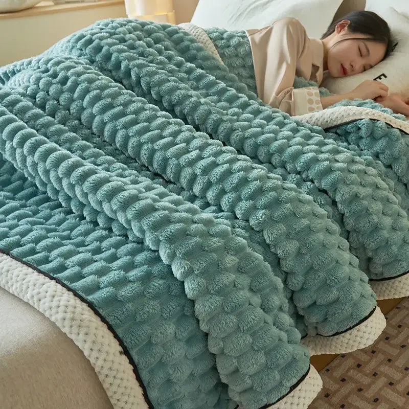 A plush mint-green cozy coral fleece bed blanket with honeycomb texture and cream trim perfect for decorbites cozy coral decor