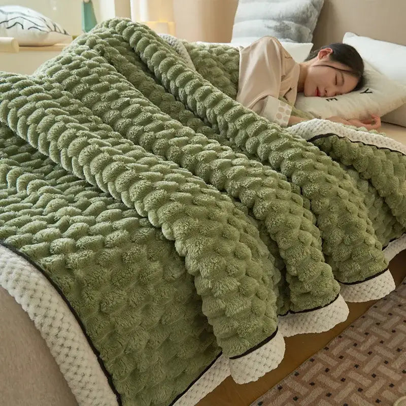 A plush olive green cozy coral fleece bed blanket with honeycomb texture and white trimmed edges by decorbites cozy coral