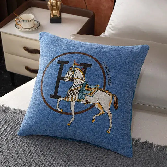Blue pillow cover featuring a horse embroidered jacquard design with ornate tack and paris rome text decorbites horse embroidered