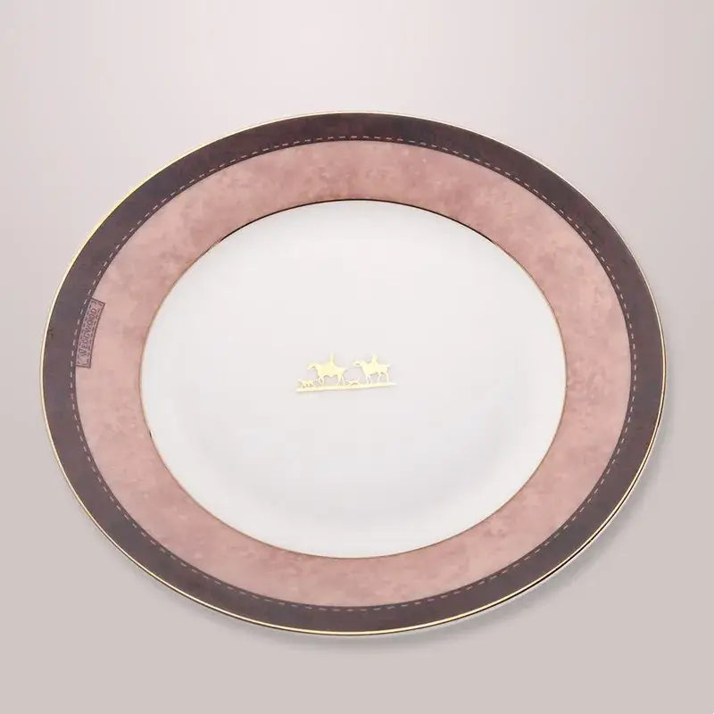 A delicate pink and brown decorbites bone china tableware set plate with gold trim featuring an elegant horse motif