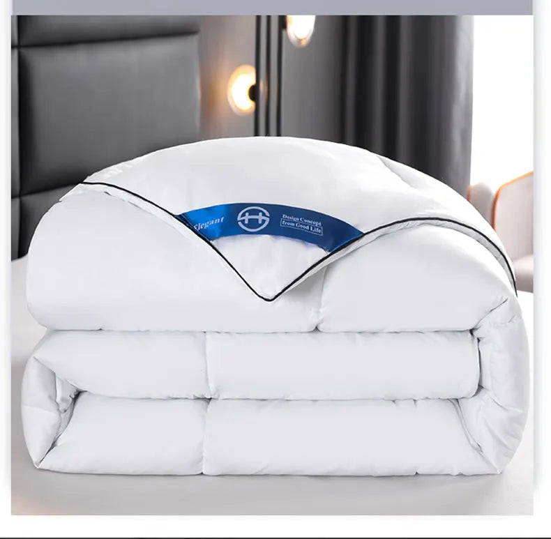 White quilted hotel style comforter with black piping and blue elegant label lightweight soft breathable winter quilt