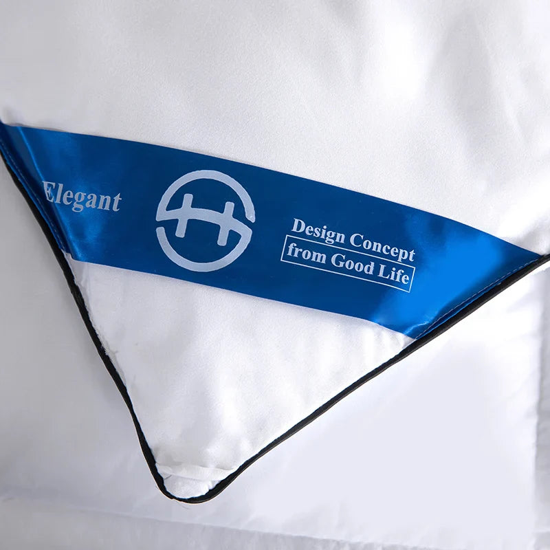 White quilted lightweight fluffy comfortable hotel style comforter with blue satin tag for queen king bed winter use