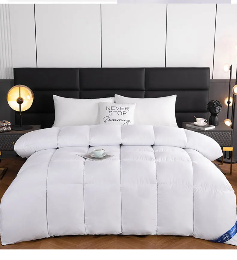 White quilted comforter with soft plush texture and stitched panels lightweight breathable warm winter quilt 220x240 cm