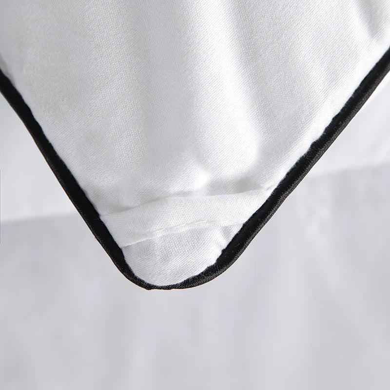 White cotton pillowcase with black stitched border paired with hotel style lightweight fluffy queen king comforter