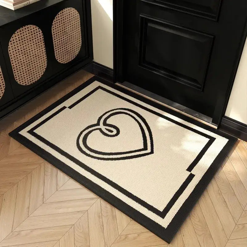 Cream-colored houndstooth black ivory area rug with bold black heart and double border placed before dark door decorbites houndstooth black