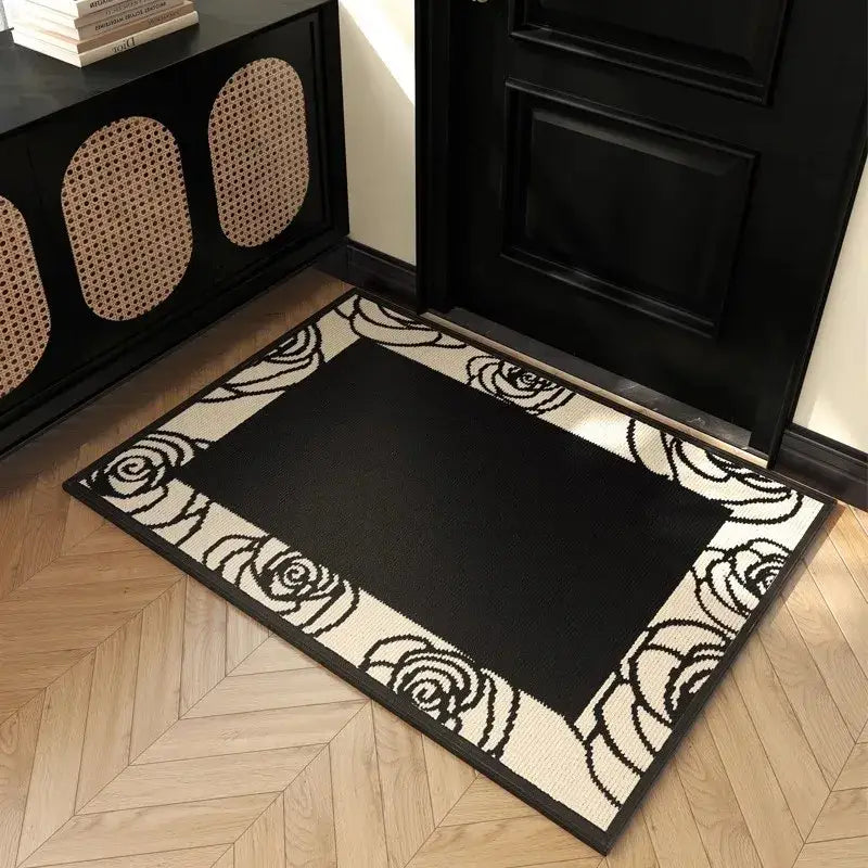 Black and cream rose patterned woven entrance mat complementing decorbites houndstooth black ivory area decor