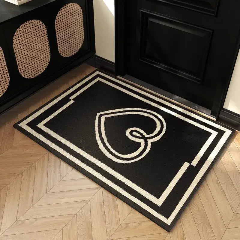 Black and white woven houndstooth black ivory entrance mat with stylized heart design and geometric border for living room floor decor