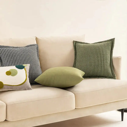 Beige velvet sofa with decorbites hounds tooth square cushion cover and decorative green and gray pillows for living room decor