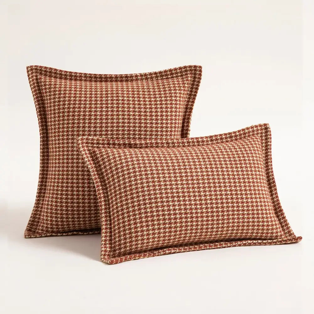 Two terracotta and cream houndstooth square cushion covers in textured woven fabric for living room decorbites decor