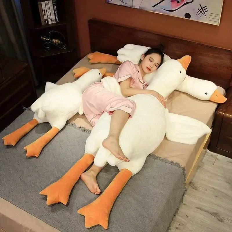 Plush white huge goose body pillow with orange beak and feet designed for comfort and bedroom decor by decorbites