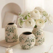Three handmade ice crackle ceramic vases with green and pink floral patterns and rustic brown rims for home decor
