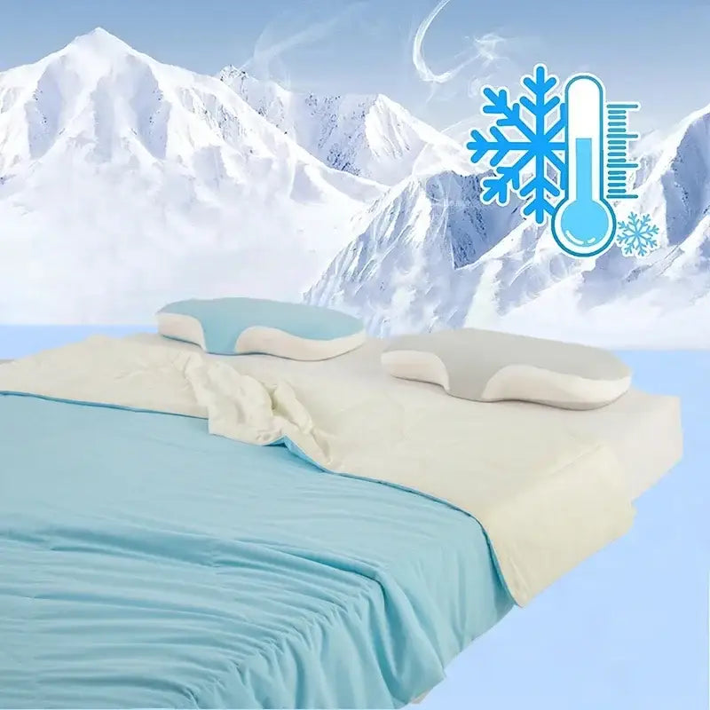 Two contoured memory foam pillows in light blue white and off-white complement decorbites ice silk cooling blanket