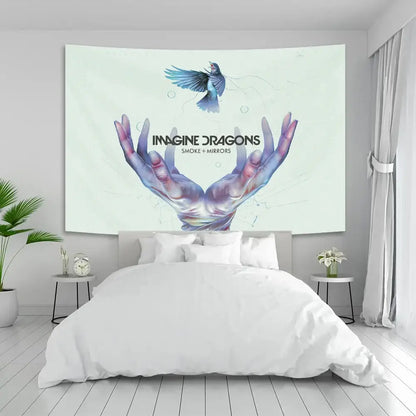 Rectangular white fabric band poster tapestry featuring imagine dragons band with hands cradling blue bird design
