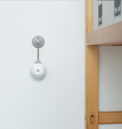 White and gray wall-mounted light fixture with a spherical design.