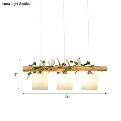 DecorBites™ Industrial 3-Light Hanging Pendant for Coffee Shop with Milky Glass Cylinder, Wooden Stick, and Bird Accent