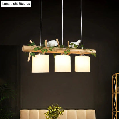 DecorBites™ Industrial 3-Light Hanging Pendant for Coffee Shop with Milky Glass Cylinder, Wooden Stick, and Bird Accent