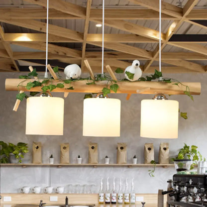 DecorBites™ Industrial 3-Light Hanging Pendant for Coffee Shop with Milky Glass Cylinder, Wooden Stick, and Bird Accent