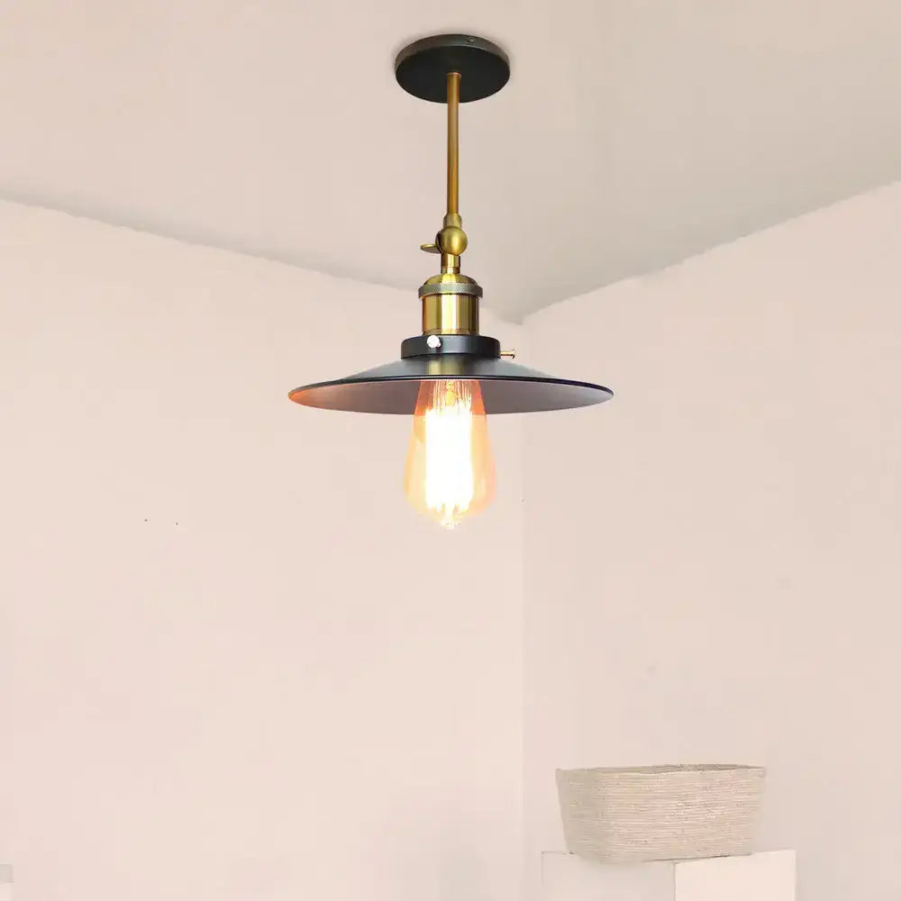 Industrial adjustable wall light with brass stem black matte shade and exposed Edison bulb for kitchen decorbites industrial adjustable