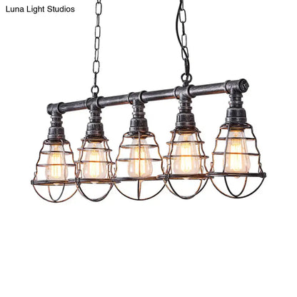 Industrial aged silver metal caged island light with black metal pendant and five exposed edison bulbs for dining room use