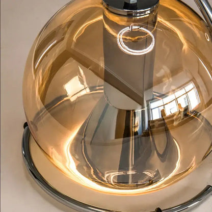 A sleek industrial amber glass pendant light with amber-tinted dome and polished chrome base for kitchen decorbites industrial amber chandelier