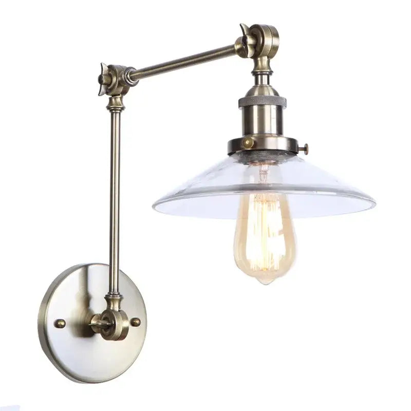 Vintage-style antique brass wall sconce with adjustable arm and clear glass shade featuring warm edison bulb decorbites industrial adjustable led