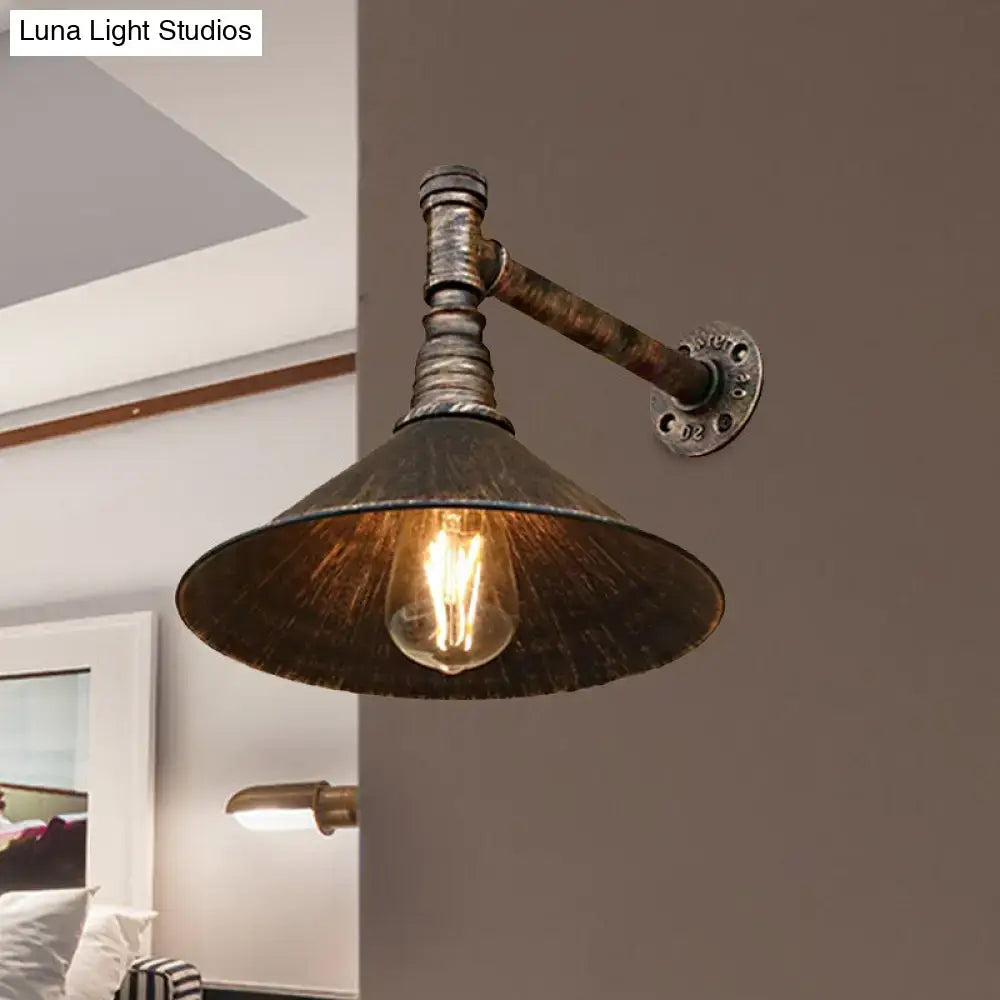 Decorbites™ farmhouse style wall sconce with antique brass cone and dark weathered metal finish featuring edison bulb