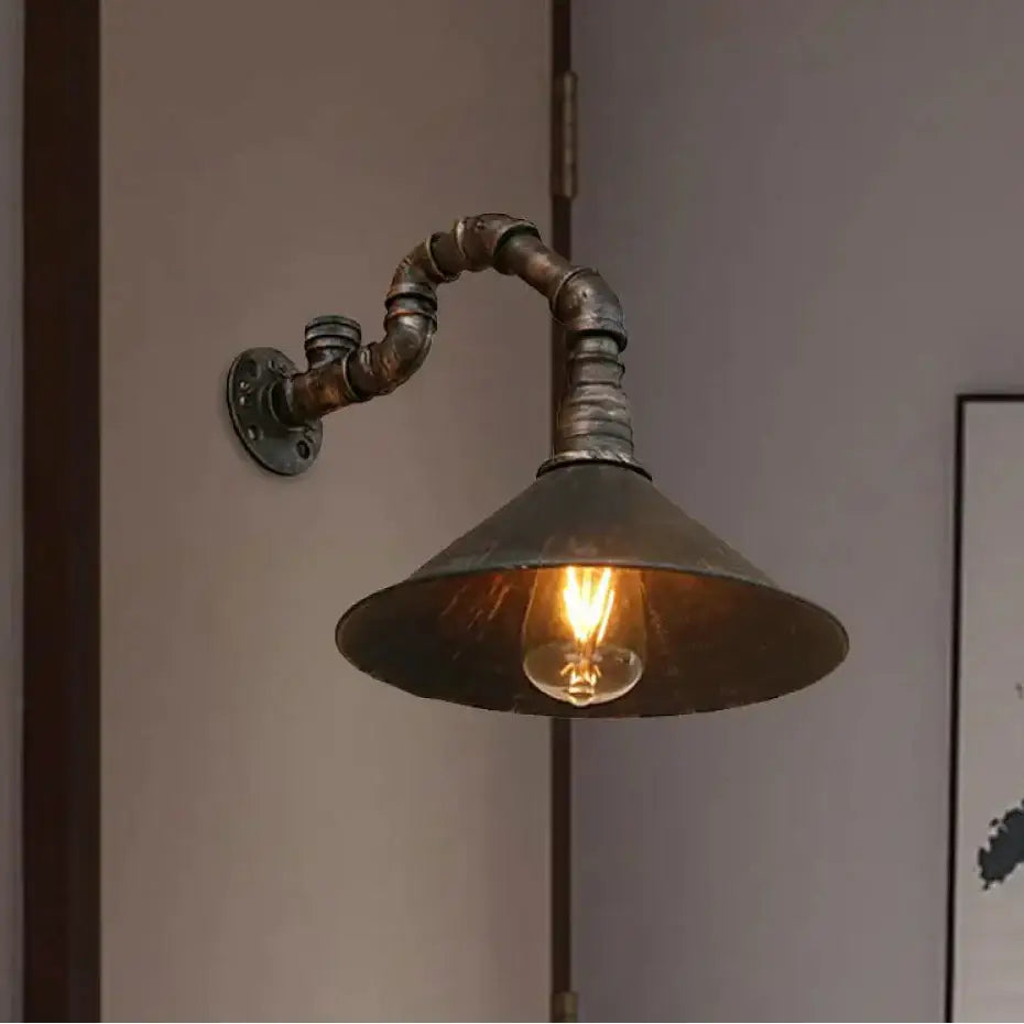 Decorbites™ farmhouse style wall sconce with antique brass cone, weathered metal finish, and exposed edison bulb lighting