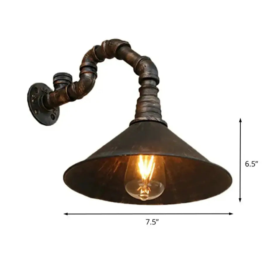 Decorbites™ farmhouse style antique brass wall sconce with metallic cone and rusted pipe arm housing an exposed bulb