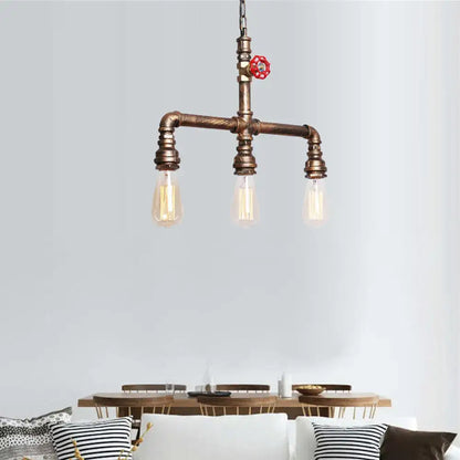 Decorbites vintage antique brass pendant light featuring three exposed filament bulbs and red valve wheel accent