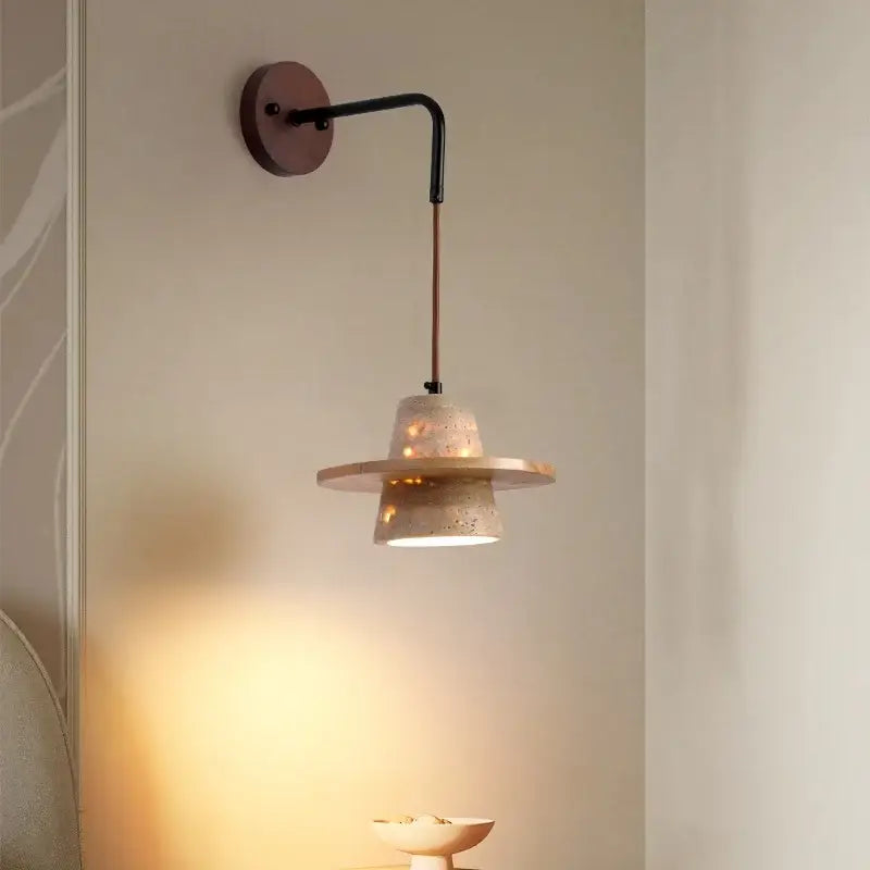 A modern beige concrete wall lamp with a black metal arm featuring decorbites led wall pull chain design