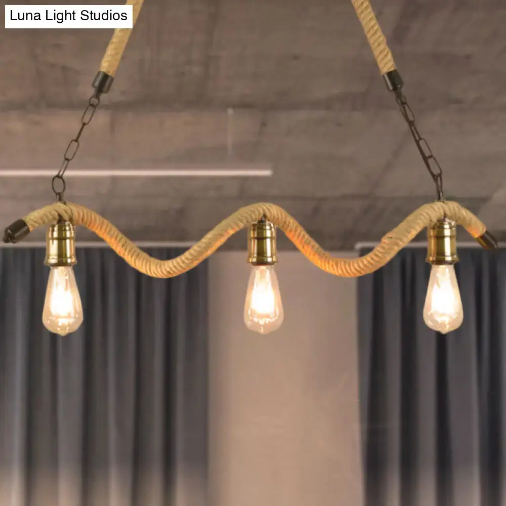Industrial beige rope pendant light with exposed bulbs featuring three edison bulbs and brass hardware for dining room