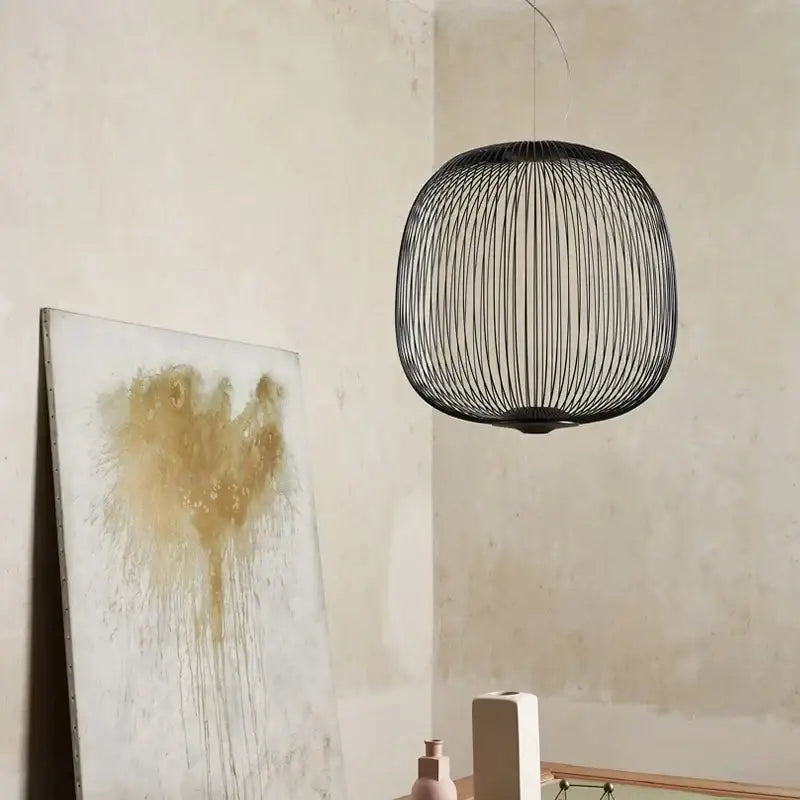 Black wireframe pendant light with spherical cage design for decorbites industrial birdcage iron table lamp use