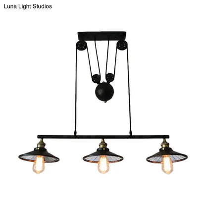 Industrial black three-bulb pendant light with pulley design for kitchen island illumination