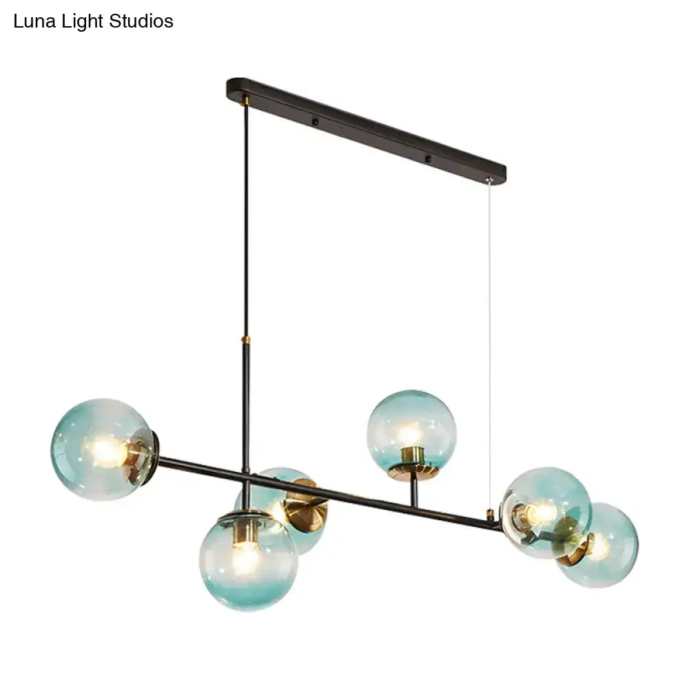 Modern 6-light island pendant with black metal frame and teal glass spheres for stylish industrial lighting