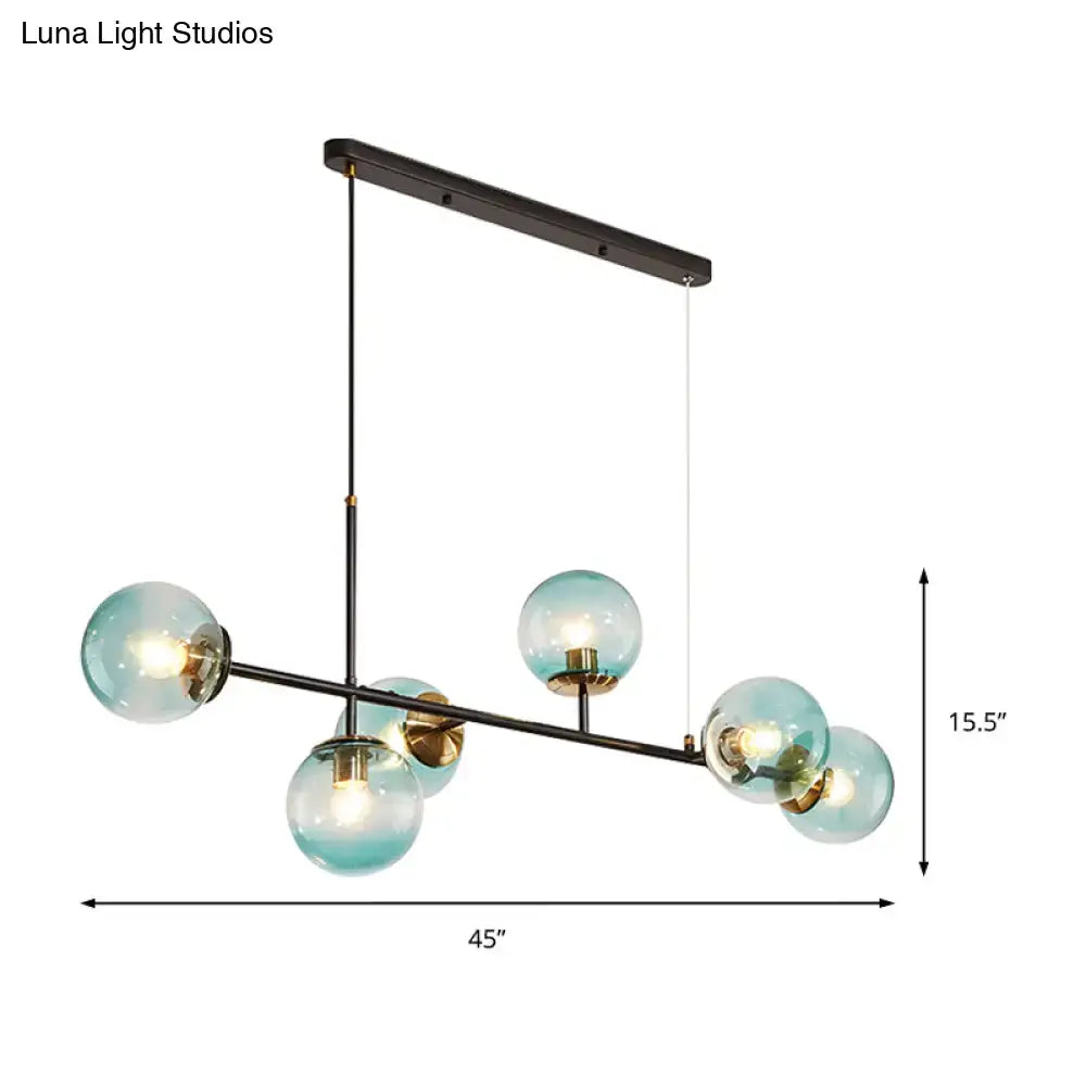 Modern black metal 6-light island pendant with five translucent teal glass globes and adjustable cord by decorbites