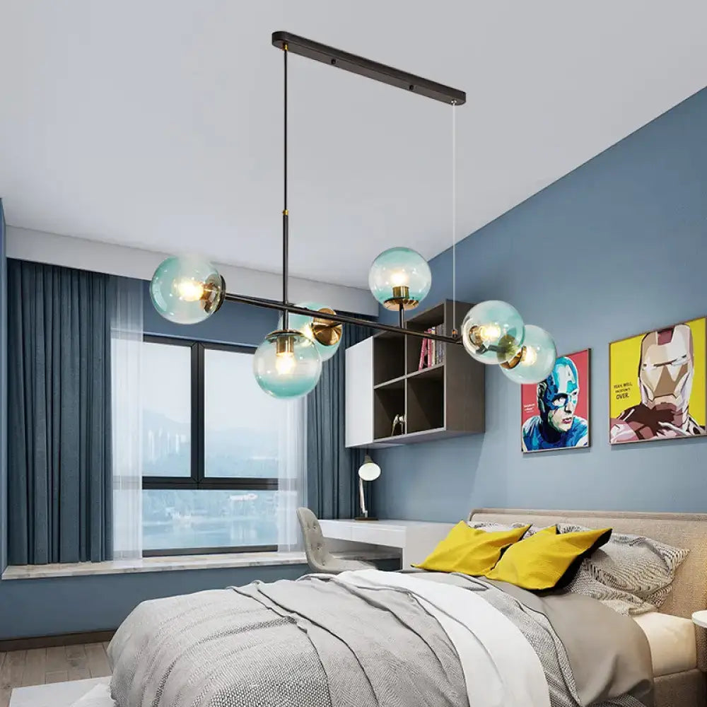 Modern 6-light island pendant with sleek black metal frame and translucent teal glass globe bulbs by decorbites