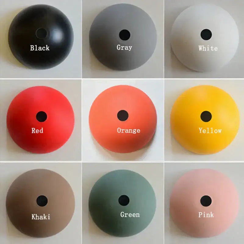Industrial black adjustable long arm pendant light with matte circular fixture available in nine solid colors for living room