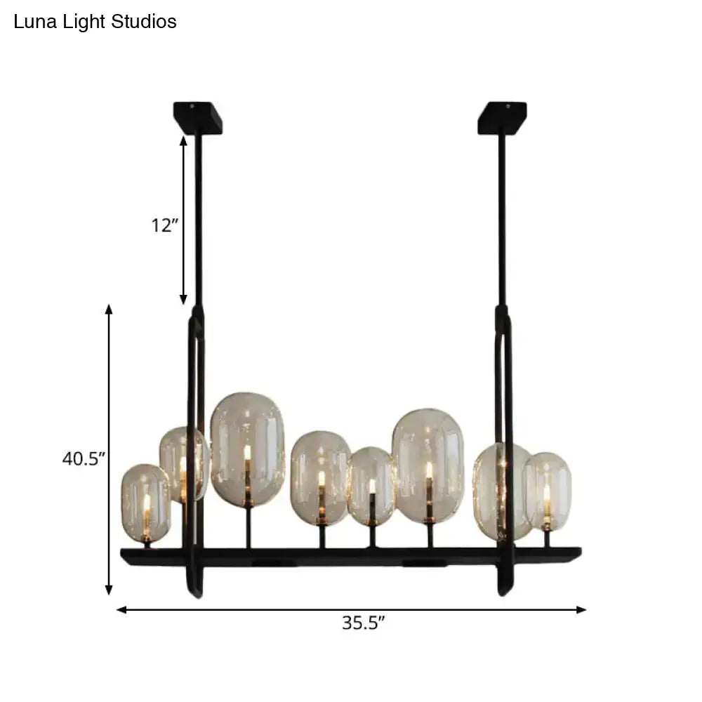 Black metal chandelier with seven frosted globe shades featuring chain cord length and fixture height details