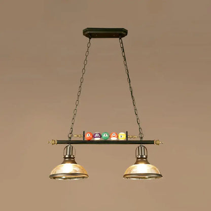 Decorbites™ industrial style hanging light with black metal finish, brass dome shades, and colorful billiard ball deco