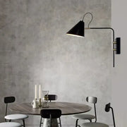 Black conical swing arm wall light with brass accents industrial vintage decorbites for living room decor