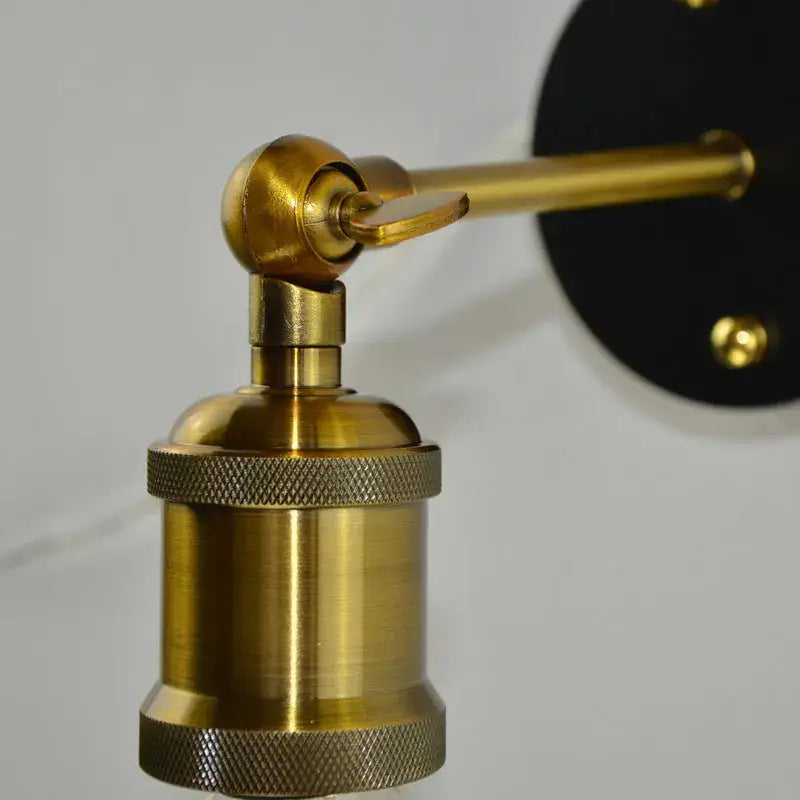 Brass-finished industrial led wall light with textured knurled grip and adjustable arm for bedroom decorbites industrial led use