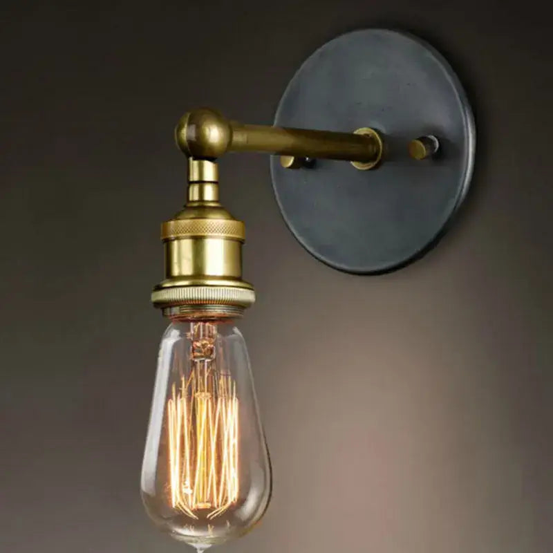 Brass-finished industrial led wall light with dark matte metal backplate and exposed filament bulb for bedroom decorbites industrial led wall