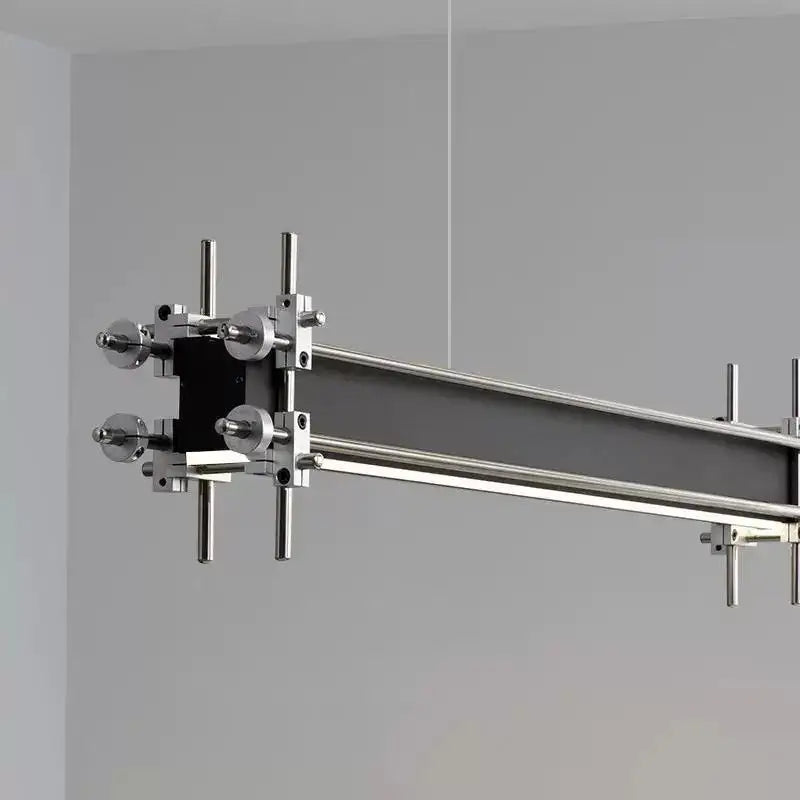 Modern minimalist linear pendant chandelier with sleek chrome frame and integrated LED strip for dining room decorbites industrial style