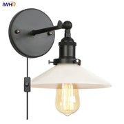 Black industrial-style decorbites led wall sconce with white ceramic shade and exposed edison bulb for bedroom lighting