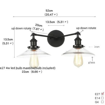 Black iron wall light fixture with two adjustable arms and clear glass shades for industrial bedroom decor