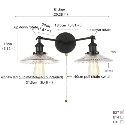 Industrial black iron wall light fixture with two adjustable arms and clear glass shades for bedroom sconce use