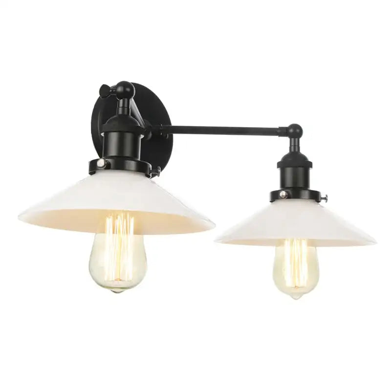 Black metal wall light fixture with two white glass shades and exposed filament bulbs for bedroom use