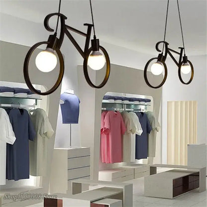 Industrial black bicycle pendant light with circular frame and exposed bulb fixture for living room decorbites industrial bicycle decor