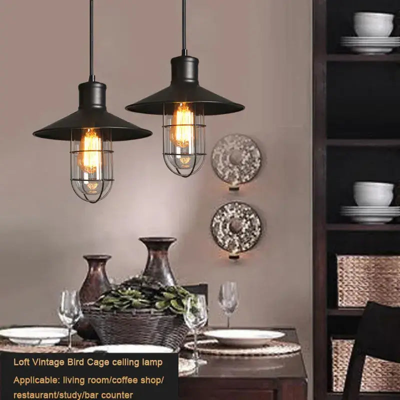 Industrial black bird cage pendant light with exposed filament bulbs and wire cage design for dining room decorbites bird cage